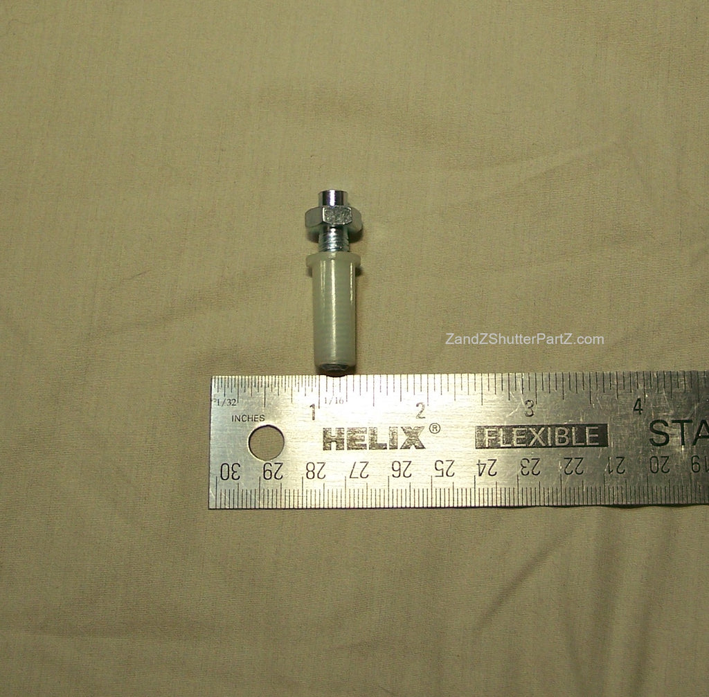 Adjustable Nylon Bottom Pivot shown next to a ruler. Use for Bi-Fold & Bypass Plantation Shutters - Shutter Track Hardware